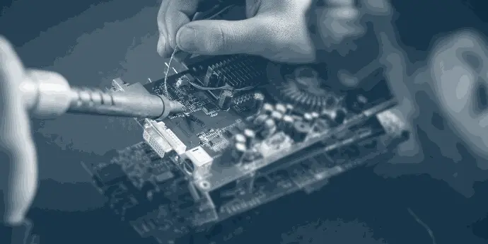 Engineer focused on a computer, symbolizing innovation in embedded hardware solutions.